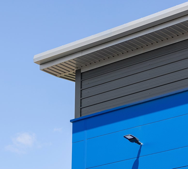 A floodlight on the exterior of a stylishly finished industrial unit